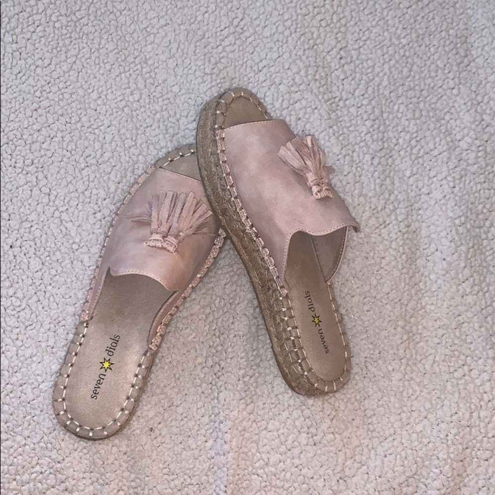 Pink and tan slides with a platform